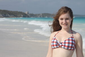 Girl in Bikini at Beach with Tulum in background